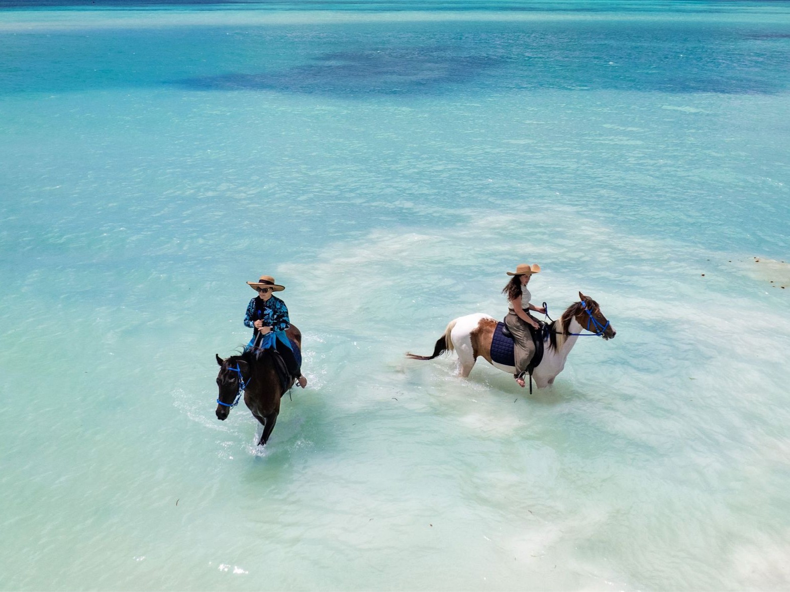 Riding a horse through the shallows of the Indian Ocean