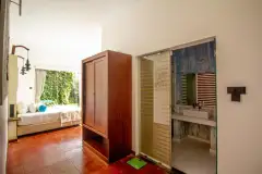 View from inside a Courtyard room at Ayurvie Weligama looking toward the enclosed courtyard.
