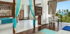 Master Suite (Sea View) at Ayurvie Weligama with ocean-view sitting area and floor-to-ceiling glass.