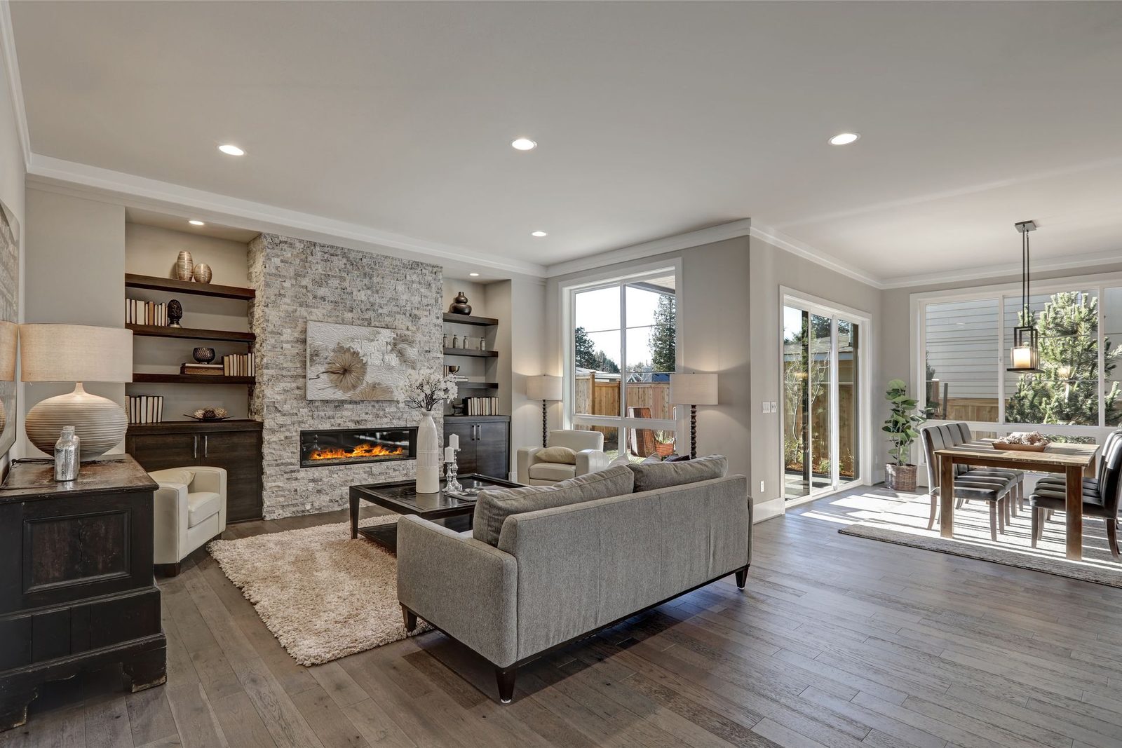 Gray living room with stone fireplace repaint