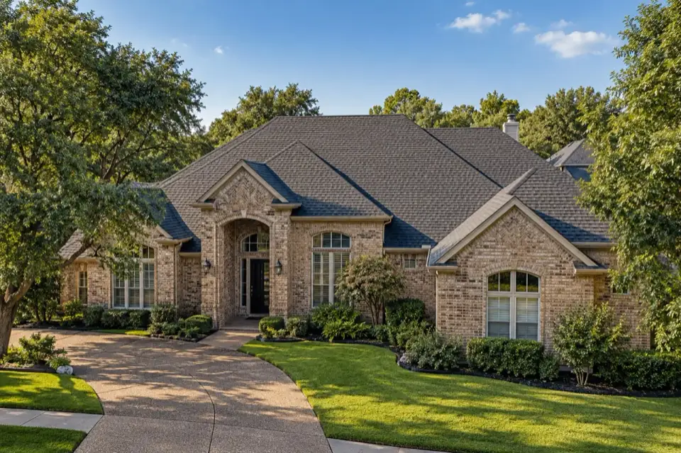 Brick North Texas home with a shingle roof