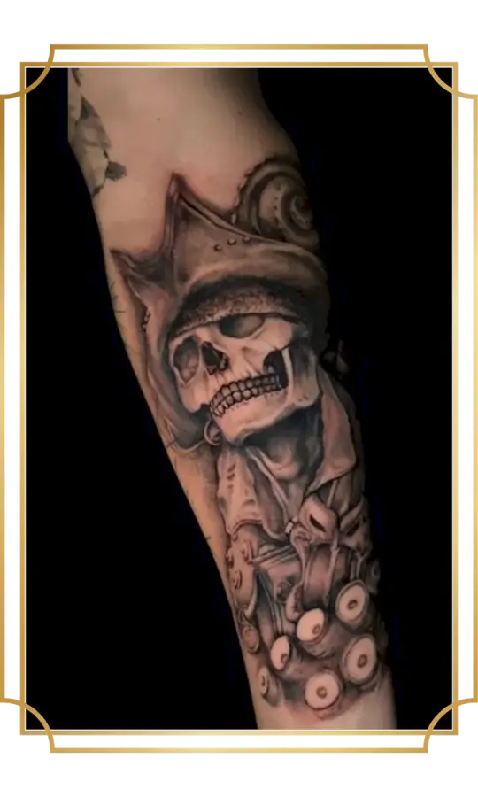 Black and gray pirate skull tattoo with tricorn hat and octopus tentacles on the forearm