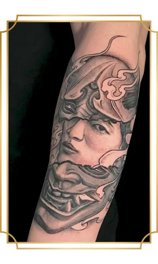Black and gray illustrative female warrior tattoo with ornate helmet on the forearm