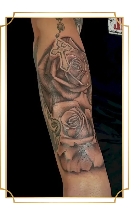 Black and gray two roses tattoo on the forearm
