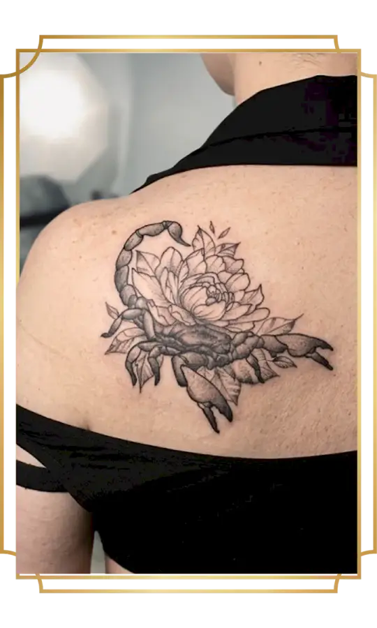 Illustrative fine-line scorpion and peony shoulder-blade tattoo by Alek the Saint, finished with precise linework and stipple shading