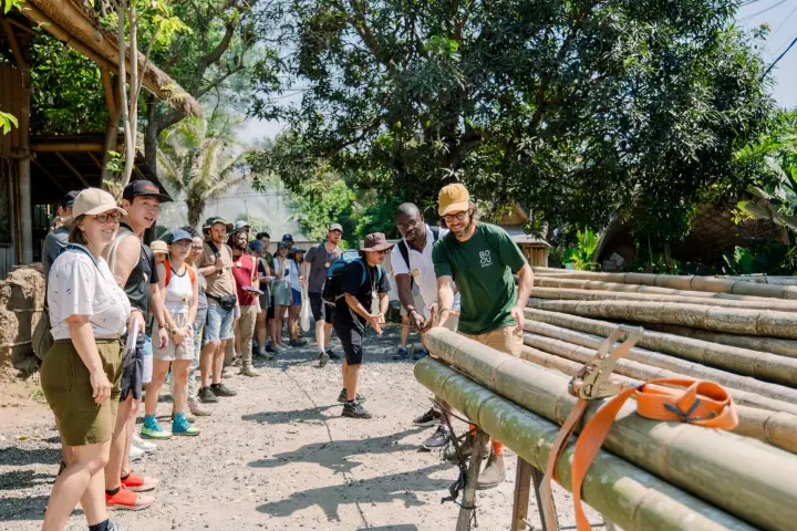 Students building a bamboo structure on the Bamboo U campus