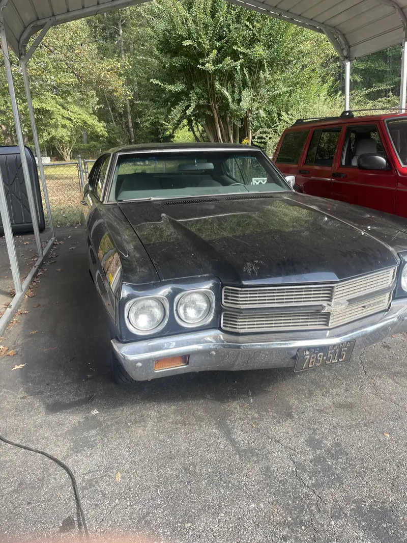 Black Chevy Chevelle before an exterior detail