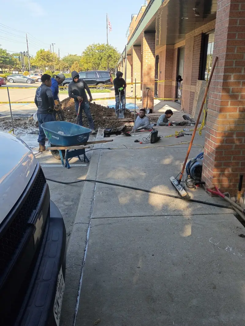Plumbing crew repairing a sewer line