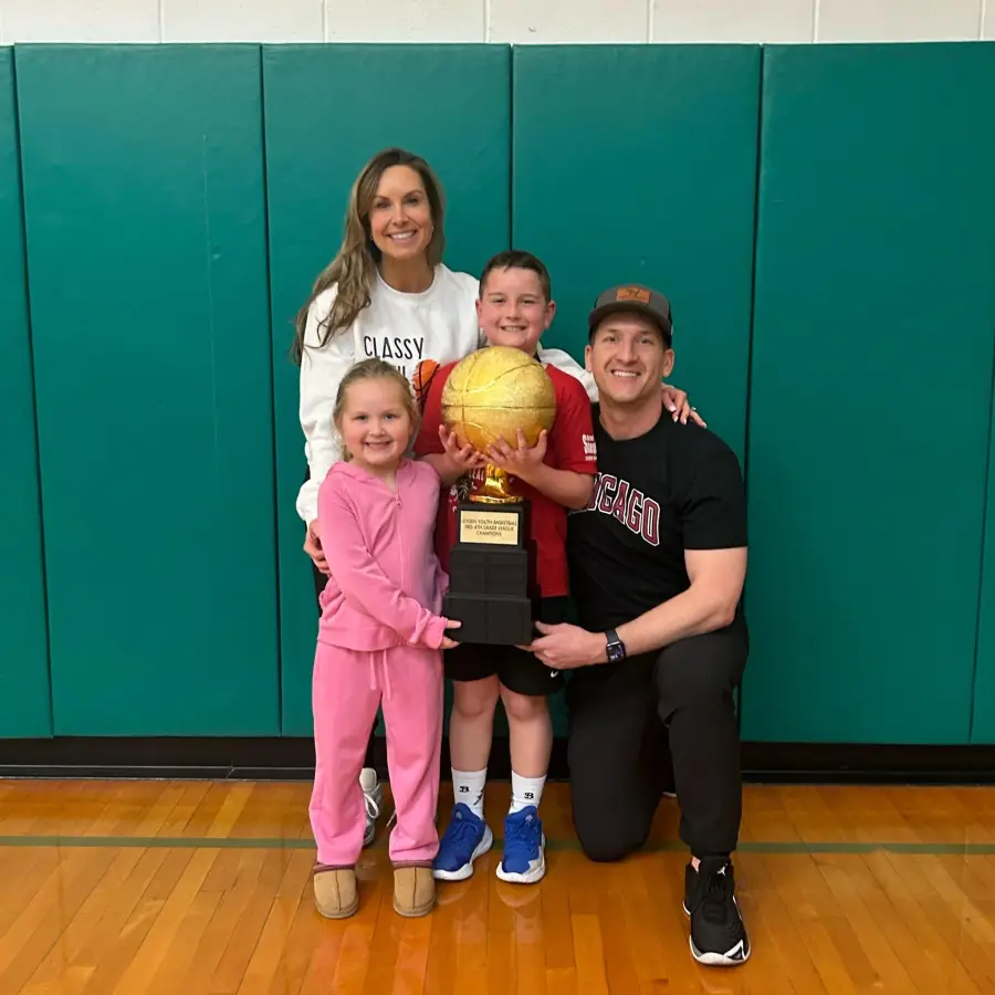 Joe with family basketball trophy