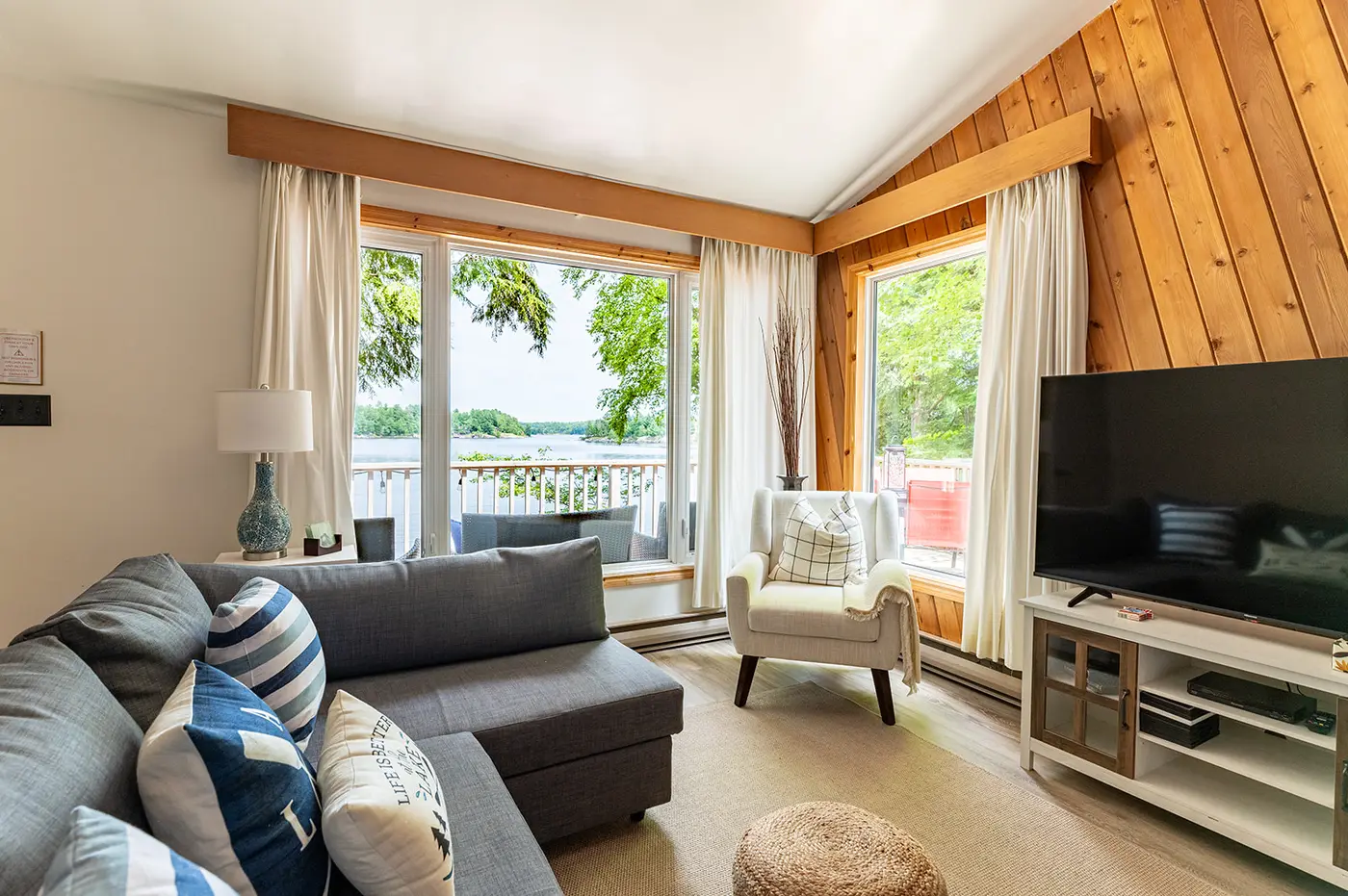 Bright cottage living room with lake view