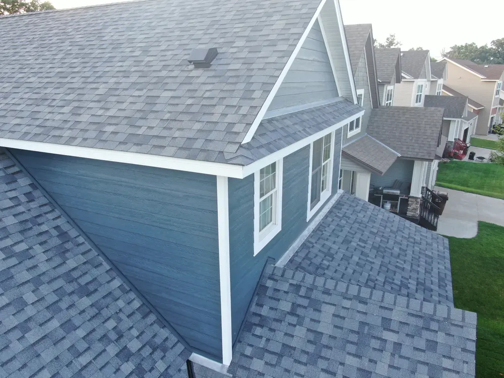 Rear roof slopes and new siding on a Minnesota home
