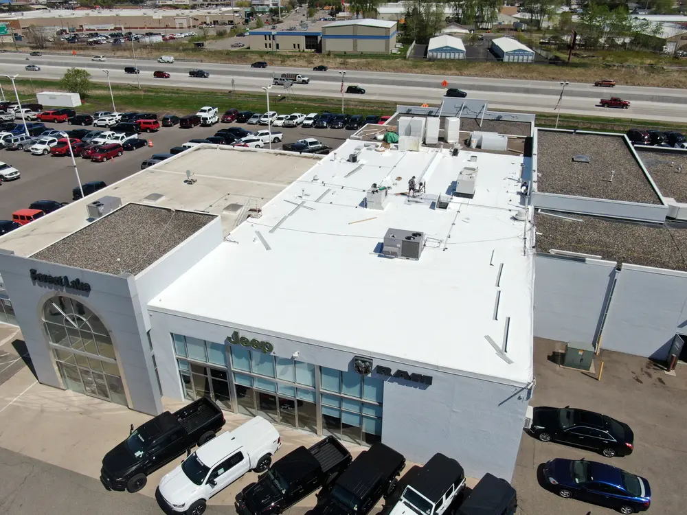 Aerial view of the Forest Lake Chrysler Dodge Jeep Ram dealership and its new white PVC roof
