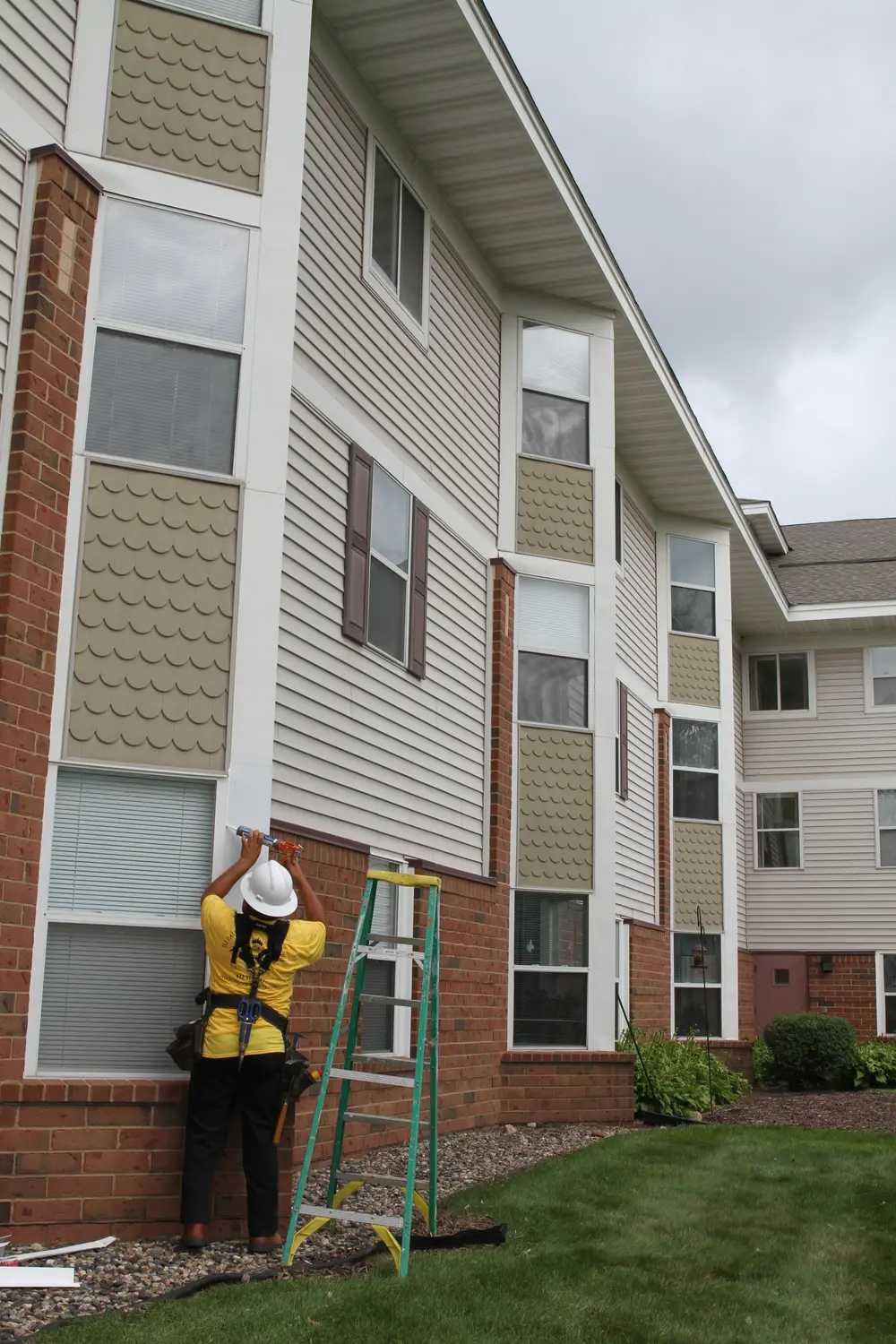 Repair King crew working on the exterior of a senior living building in Oakdale, MN