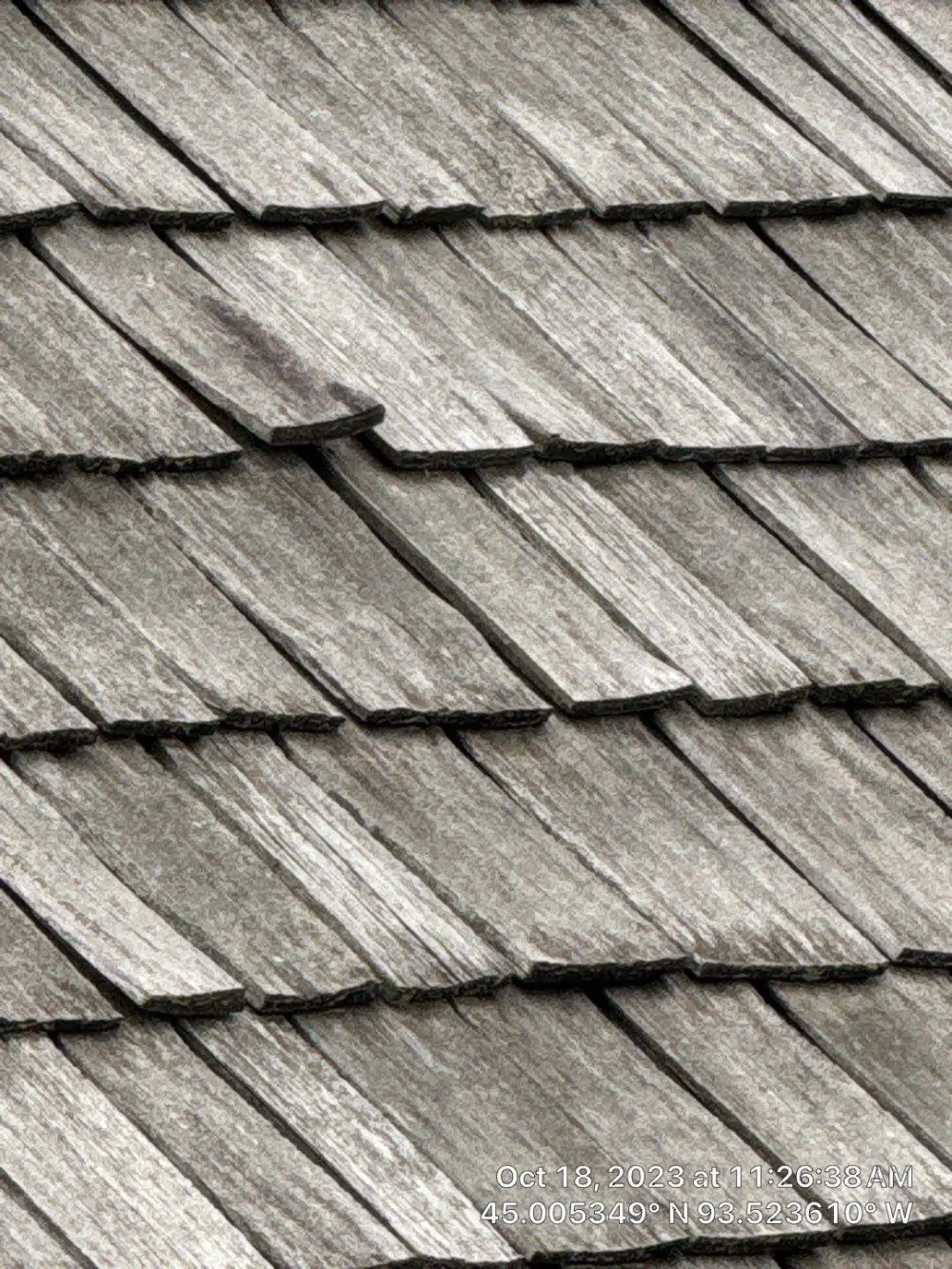Cedar shake roof slope with cupped and split shakes