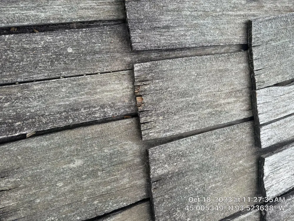 Close-up of aging cedar shakes on a Minnesota roof