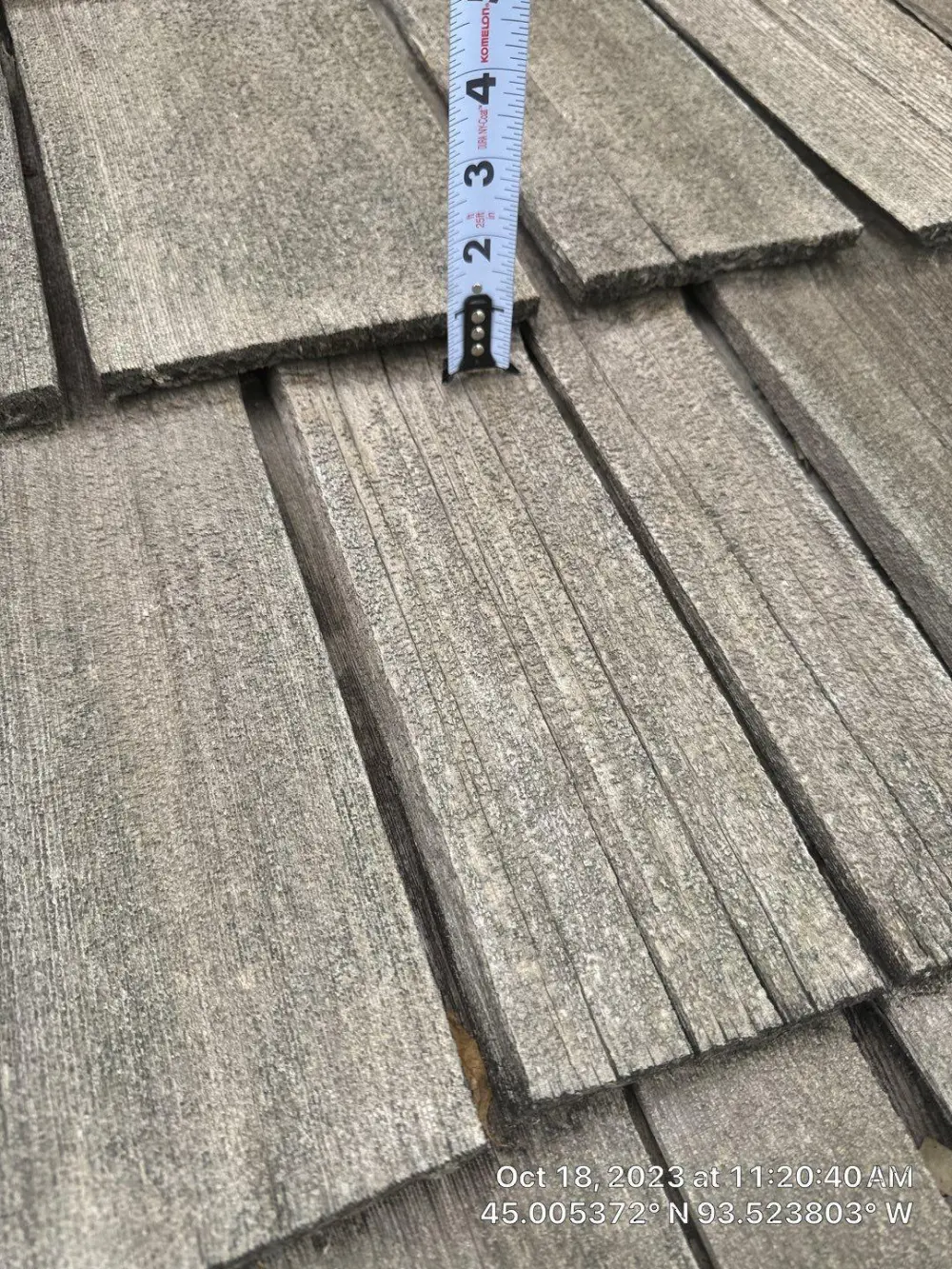 Weathered cedar shake measured during an inspection