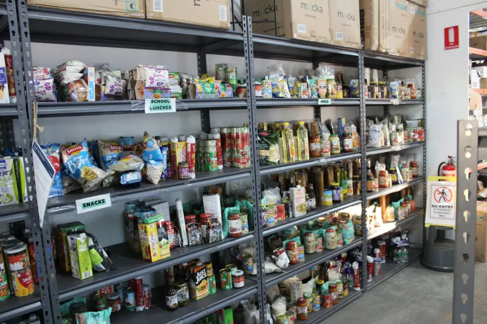 Food co-op shelves stocked with packaged and tinned food