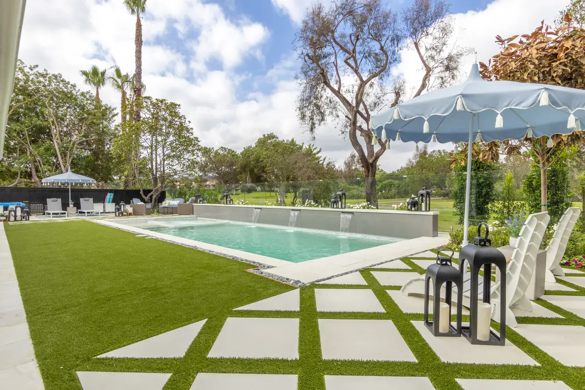 Paver patio with umbrella and pool