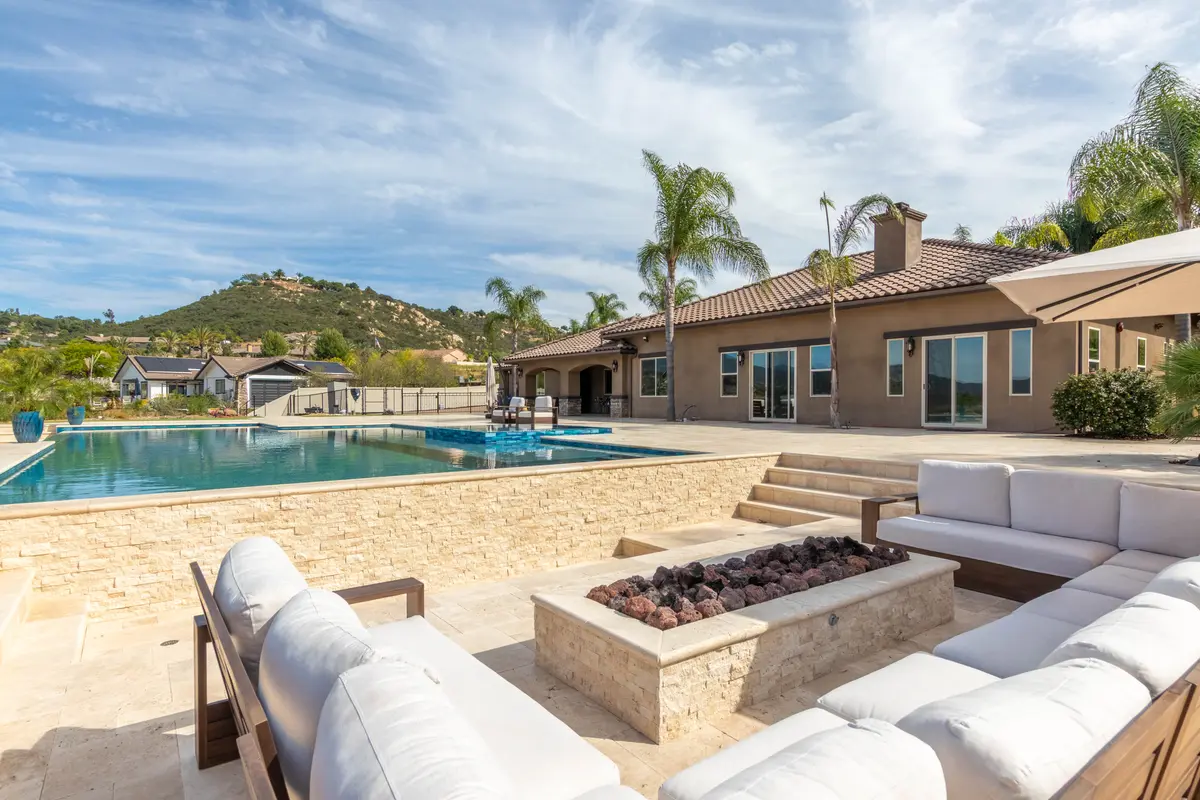 Sunken fire pit lounge with white sectional