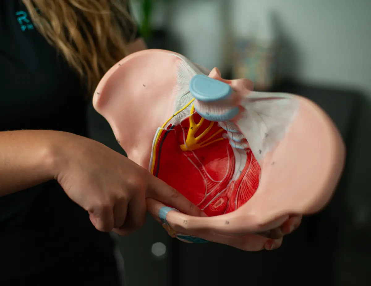 Revive pelvic floor specialist supporting a patient through a recovery exercise