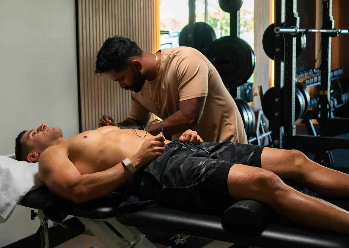 Doctor of Physical Therapy performing hands-on recovery work at Revive Physiotherapy