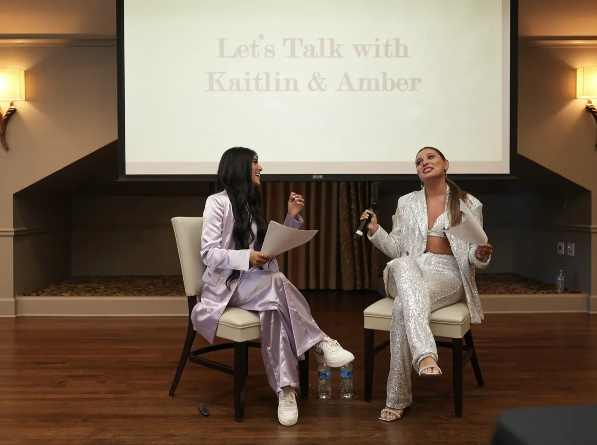 Amber Farooqui and Kaitlin seated together for a live conversation