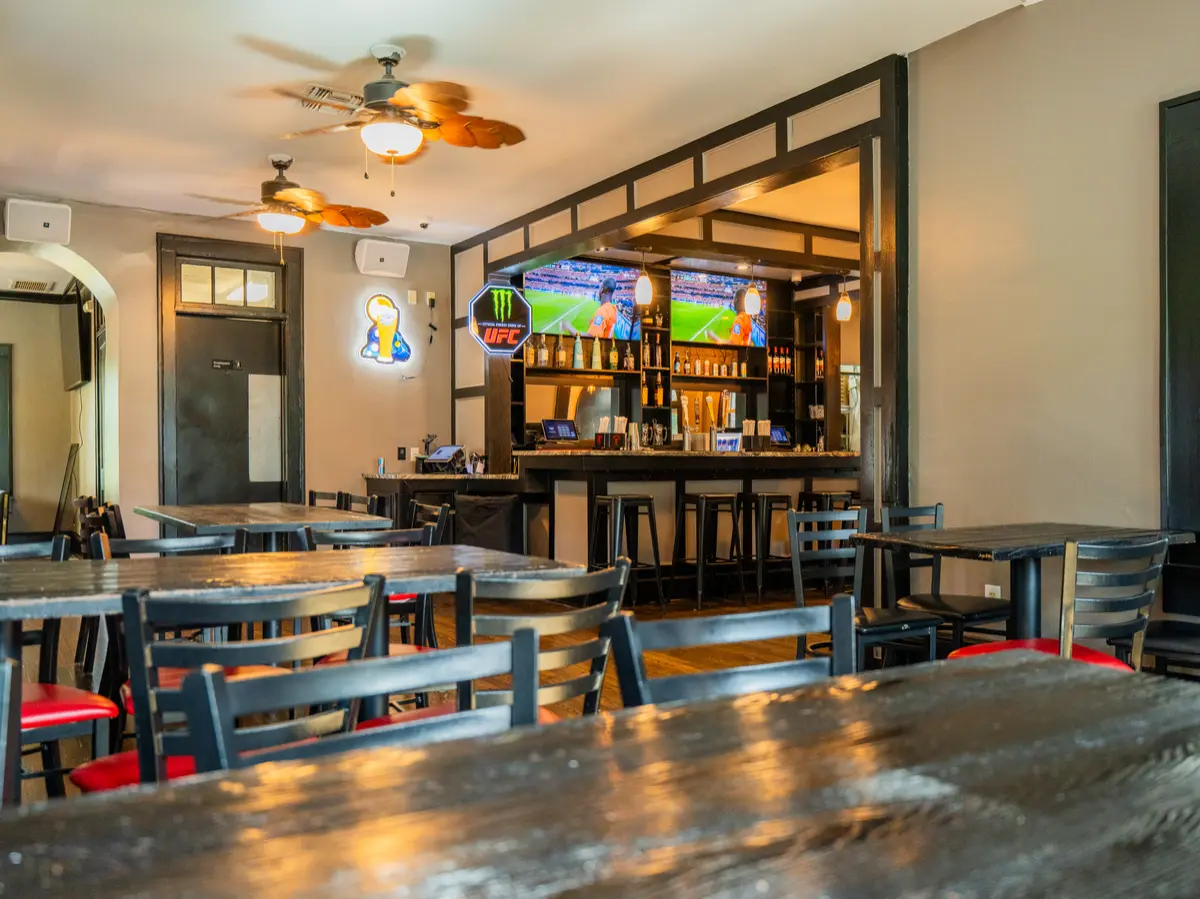 Inside dining room with the bar in the back