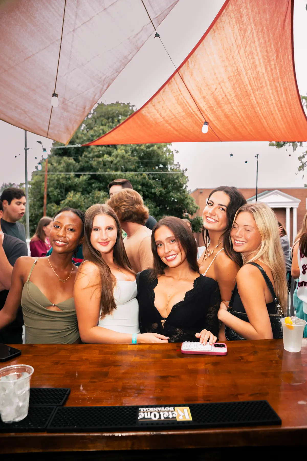 A group of friends at the patio bar