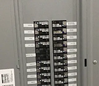 Electrical breaker panel with its cover open