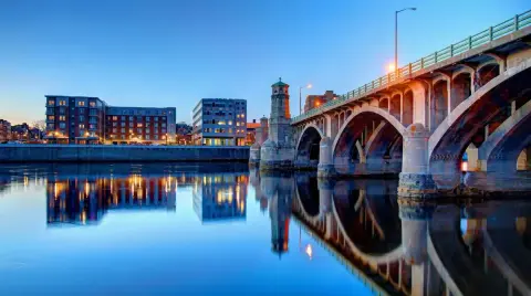 Bridge over the Merrimack River and Haverhill waterfront at dusk.