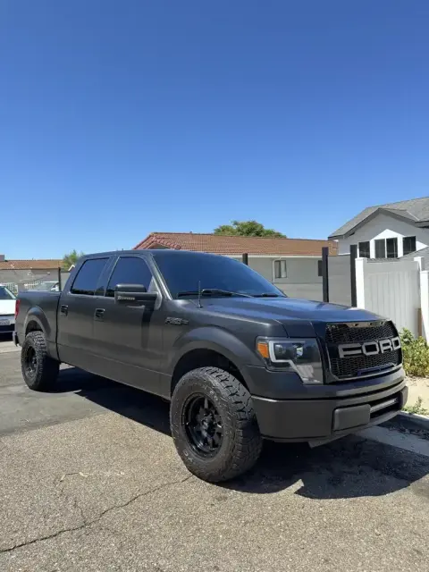 Matte black Ford F-150 after exterior detail