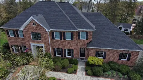 Completed roof replacement in Mechanicsburg, PA, aerial view of new roof and yard.