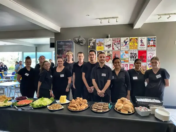 Goodness Enterprises kitchen team together in the community kitchen