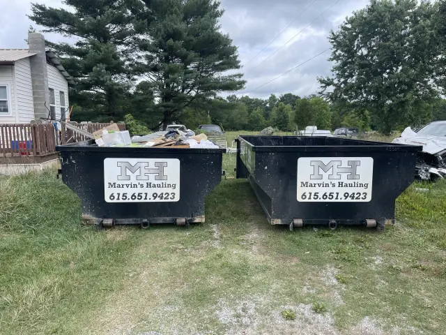 Two Marvin’s Hauling dumpsters positioned for a Middle Tennessee cleanup project