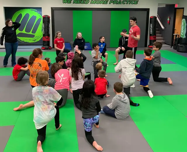 Instructor leading a kids class at Fusion Martial Arts