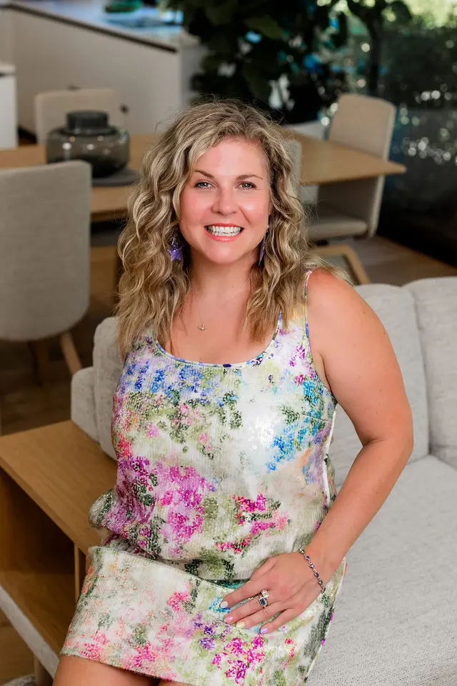Zoë Condon, founder of Z List Media and digital strategist in South West WA, smiling in a sunlit living room