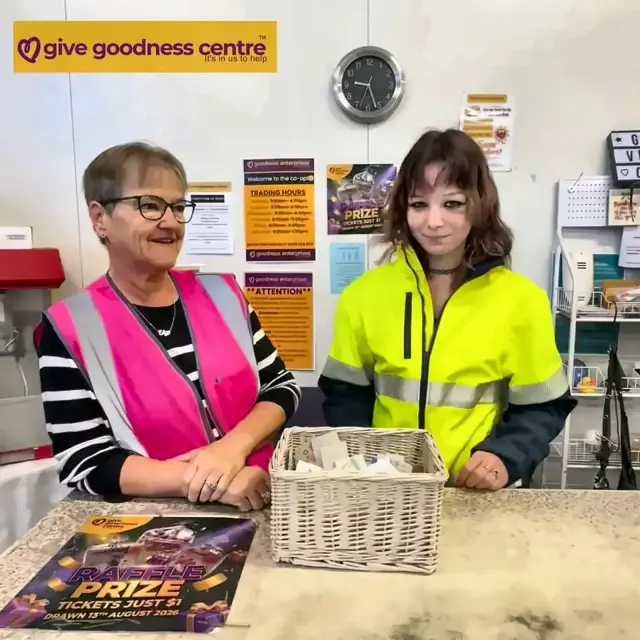 Smiling Goodness volunteers serving at a counter
