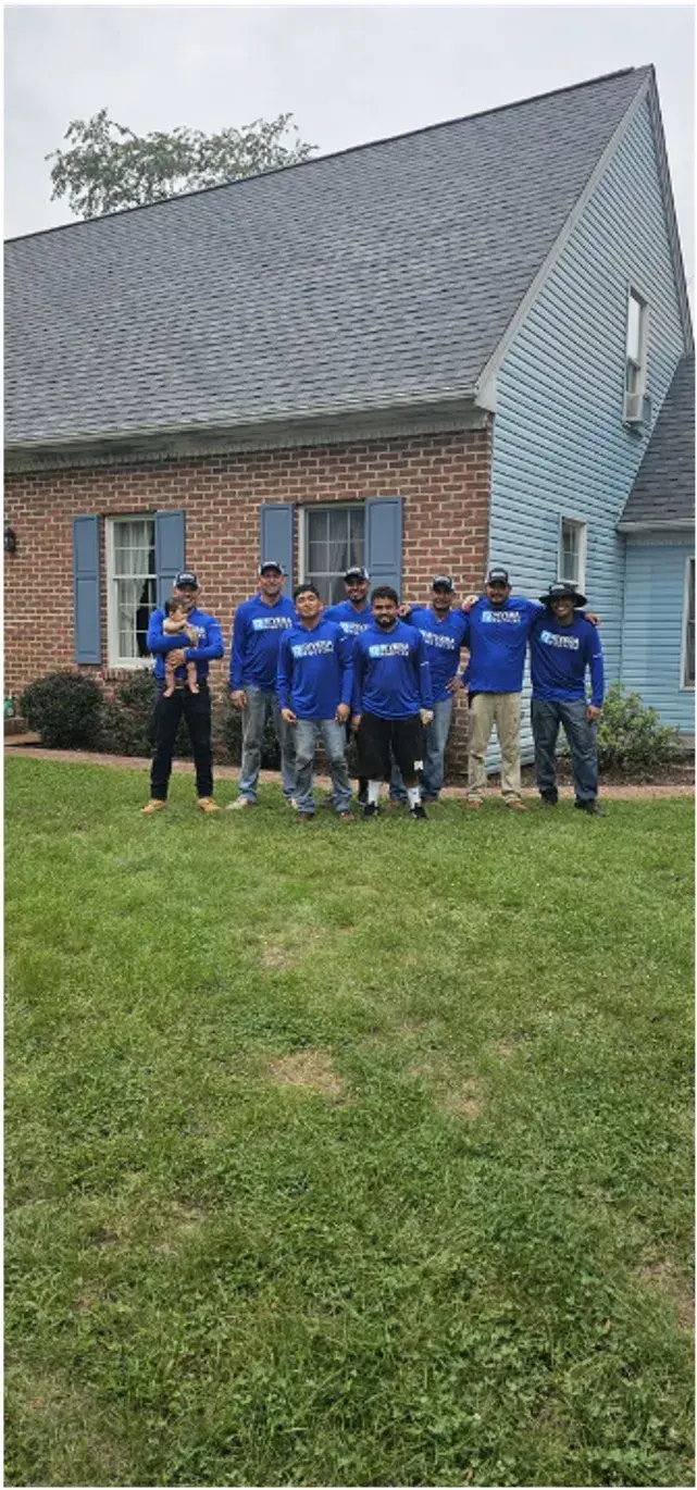 Rivera Roofing crew posed together, group photo of the team.