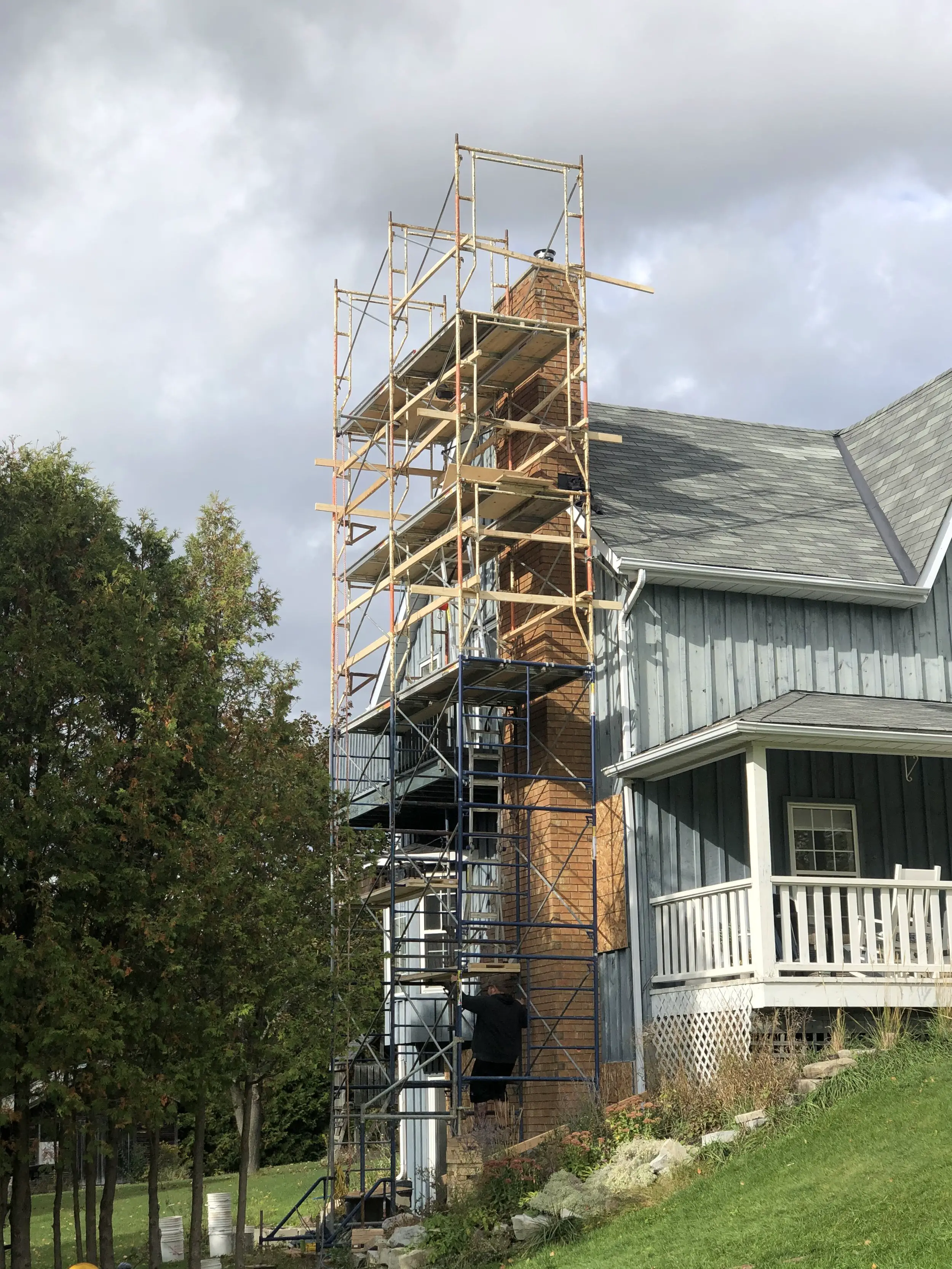 Heritage home under scaffold during a masonry restoration