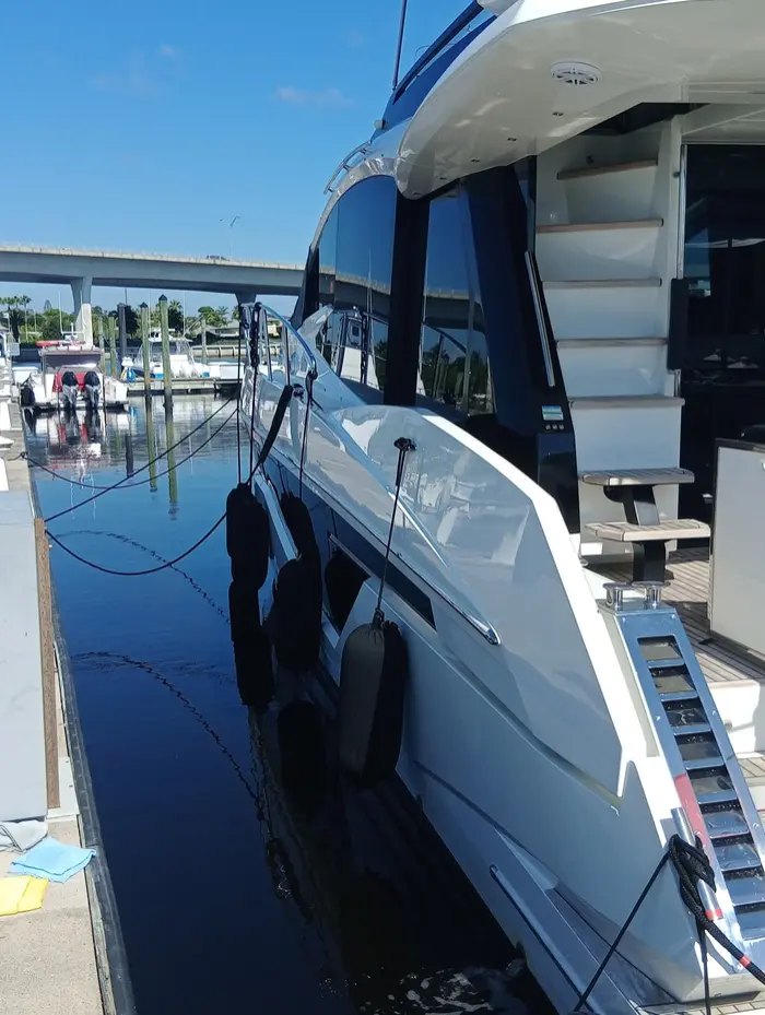 Yacht side walkway and hull at the slip