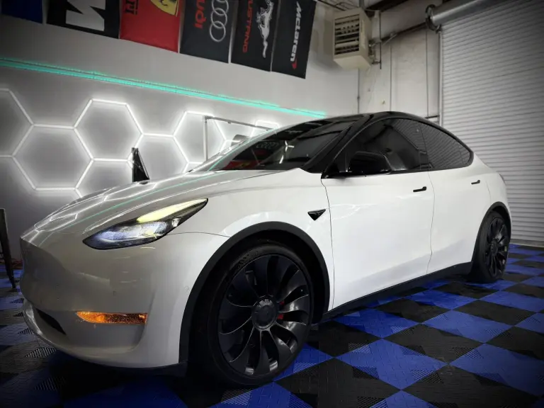 XPEL window tint on white Tesla Model Y at Venom Tint Acworth