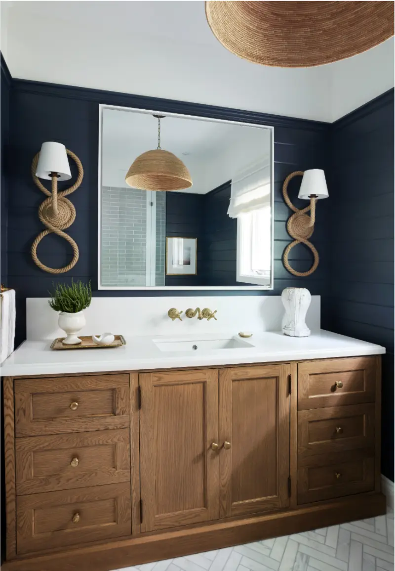 Finished bathroom with a timber vanity and navy walls