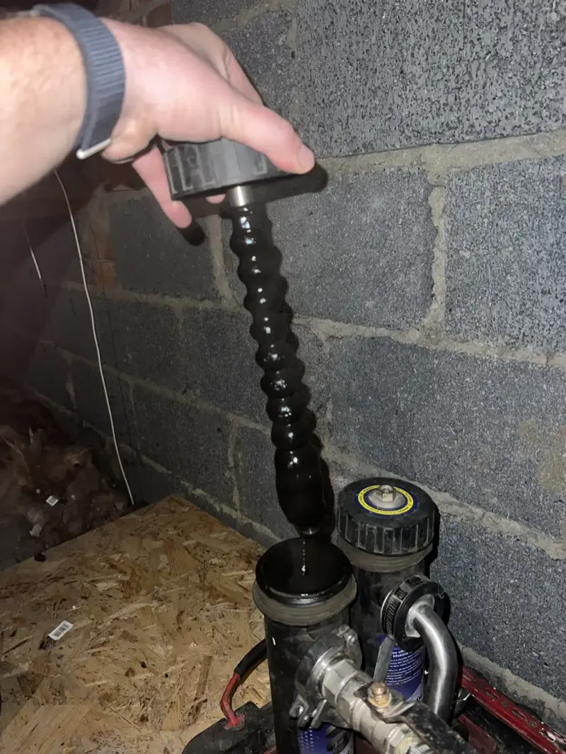 Sludge cleared from a power flush on an Oxford heating system