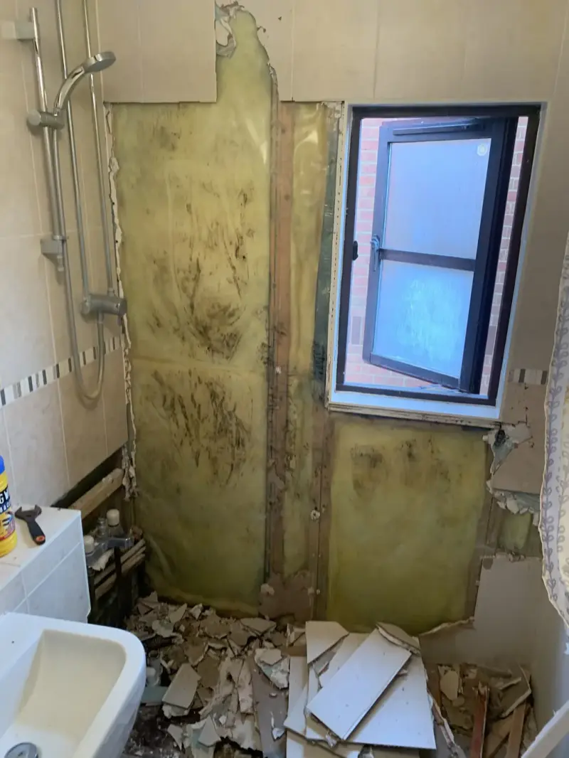 Mouldy wall stripped out in an Oxford home after a leak