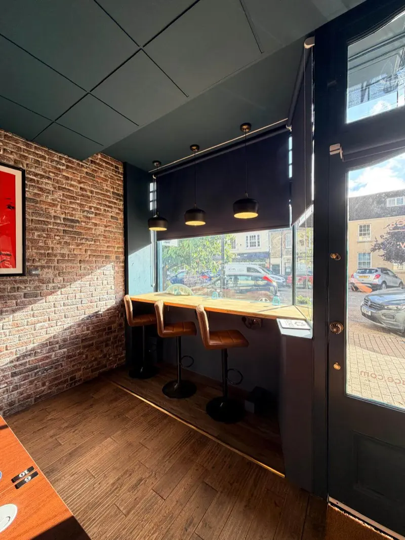 A workstation at the window of Olney Workspace