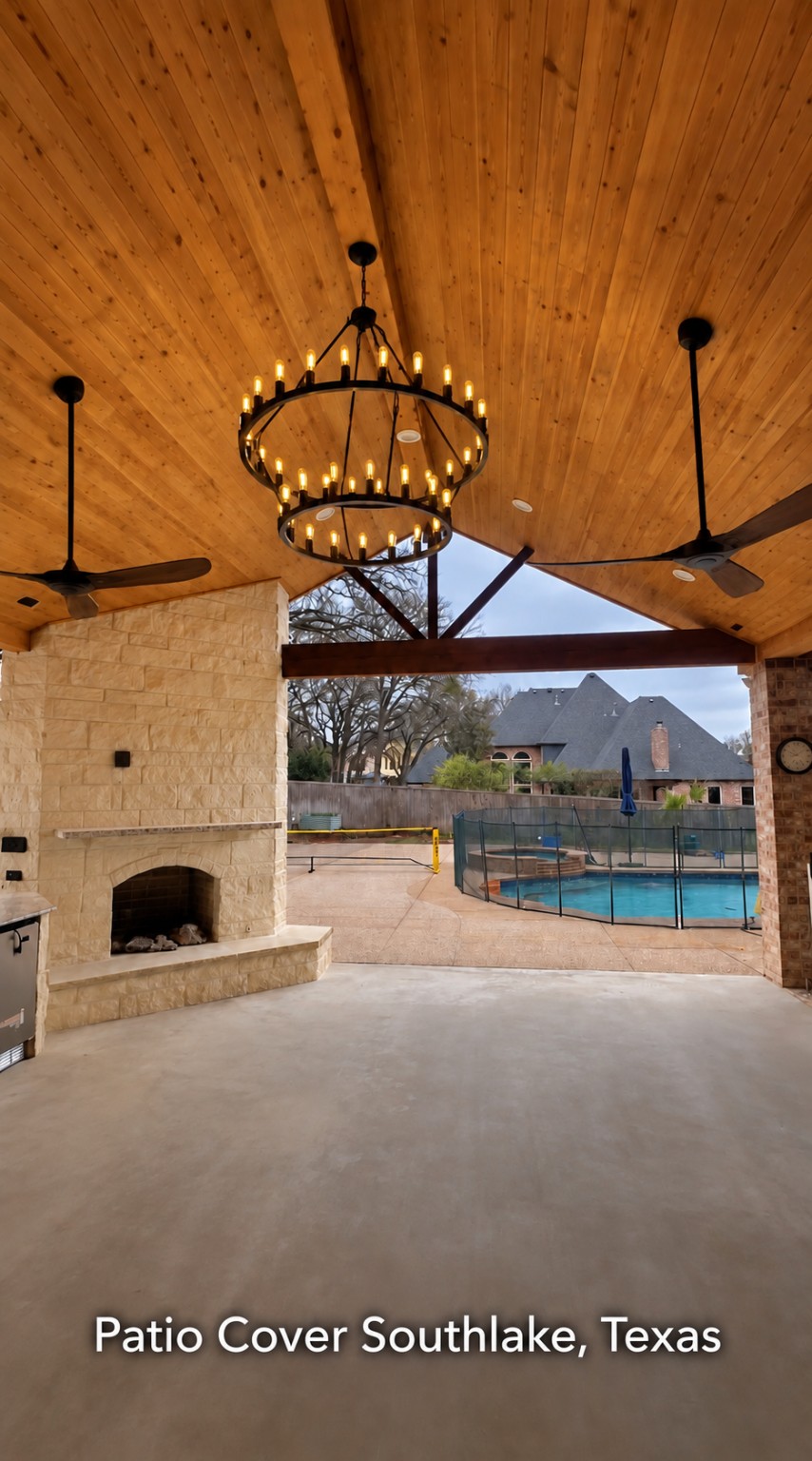 Patio cover with a vaulted wood ceiling built by Make Me A Fence in Southlake, TX