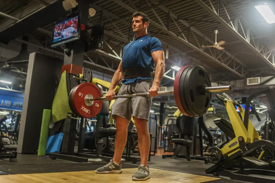 A member deadlifting on the main floor