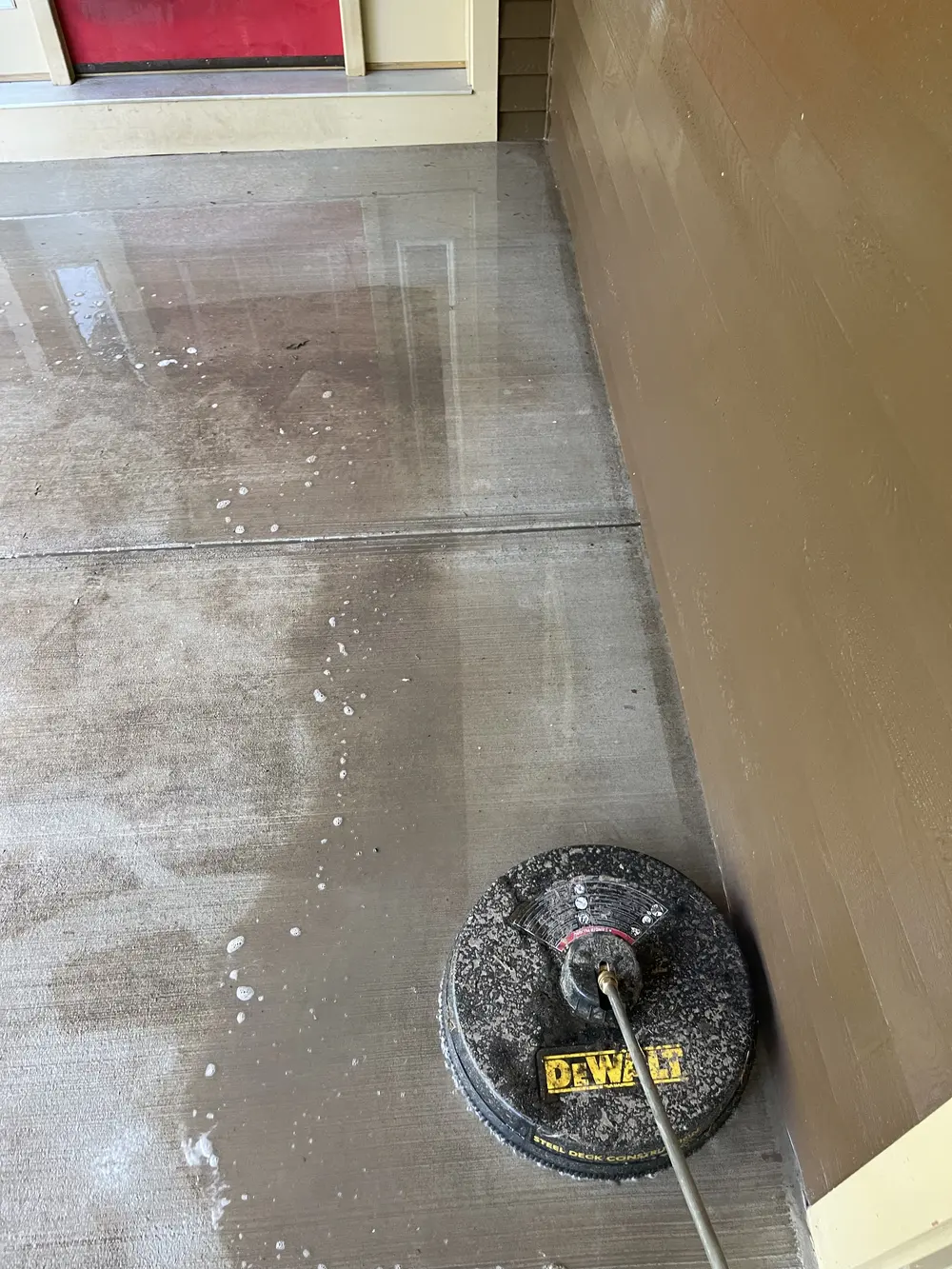 Surface cleaner working across a concrete entry
