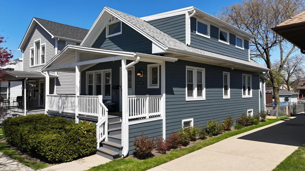 Evening Blue James Hardie siding with Arctic White trim in Edison Park Chicago