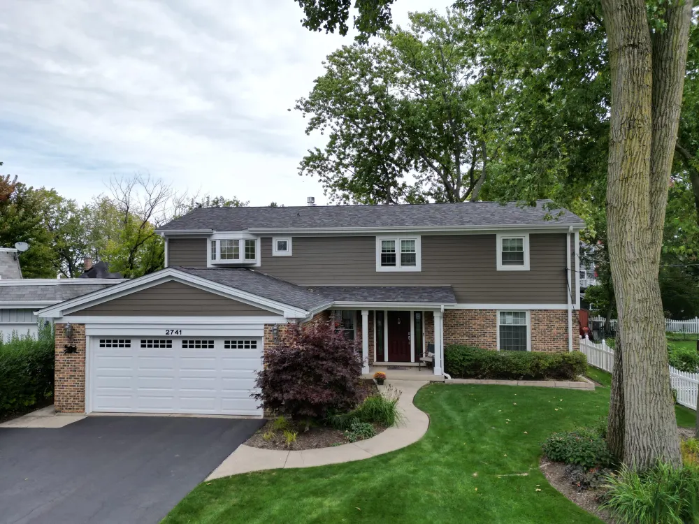 Light gray James Hardie siding project by Northwind Exteriors